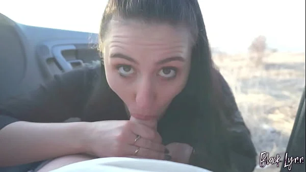Black Lynn sucks cock in a car at sunset