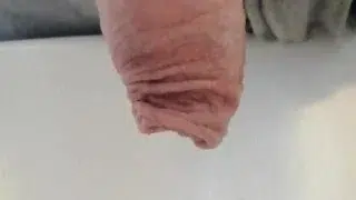 Natural uncut cock pissing on the morning thru the foreskin