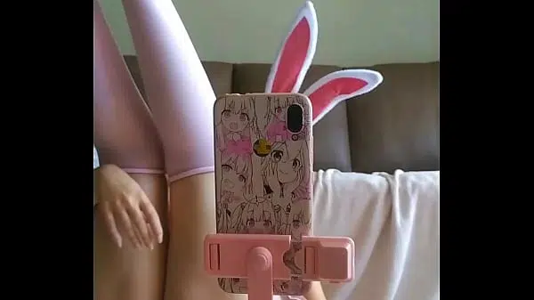 naughty student wearing a bunny outfit , tongue out, touching boobs and fingering pussy horny as fuck and kinky as hell for halloween month