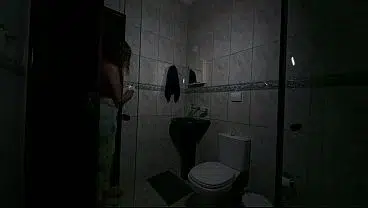 Maid changing clothes in the bathroom.