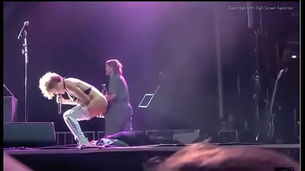 Black girl takes a piss on a man at live concert