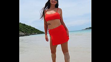 Orange bikini fun and beauty flashing on the beach