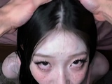Girl with long black hair kneels for deepthroat on bedroom